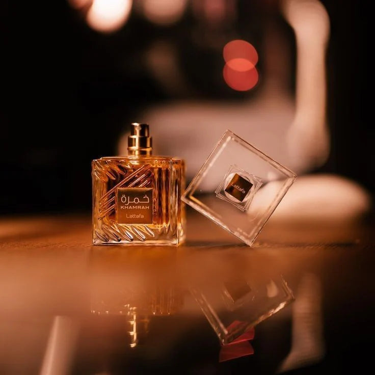 Elegant packaging of Khamrah Lattafa perfume featuring a golden box with intricate Arabic patterns, perfect for gifting.